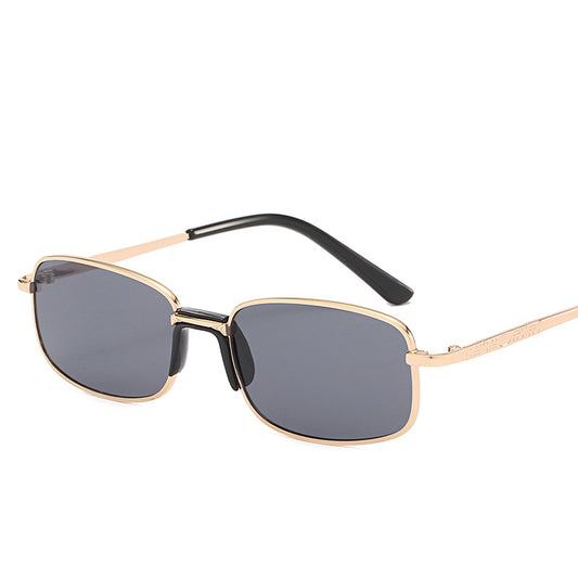 Vintage gold-colored metal frame sunglasses with light blue rectangular lenses and black temple tips.