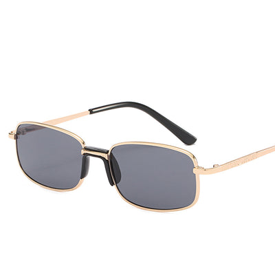 Vintage gold-colored metal frame sunglasses with light blue rectangular lenses and black temple tips.