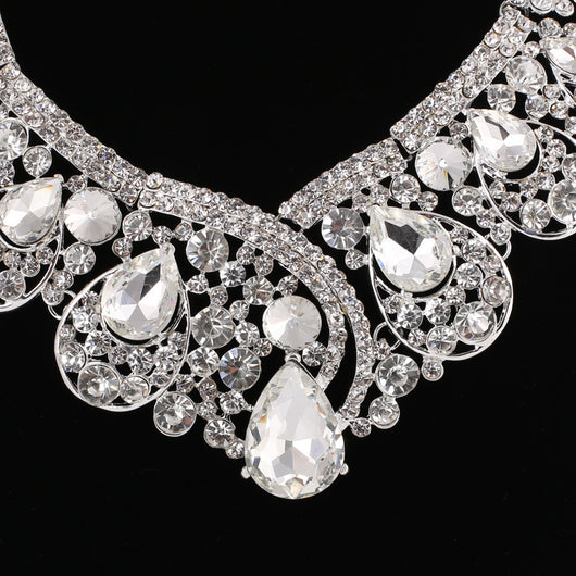 Silver-tone necklace and matching drop earrings set with clear rhinestones and teardrop crystals, ideal for weddings. - Image 3