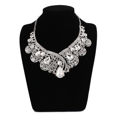 Silver-tone necklace and matching drop earrings set with clear rhinestones and teardrop crystals, ideal for weddings. - Image 2