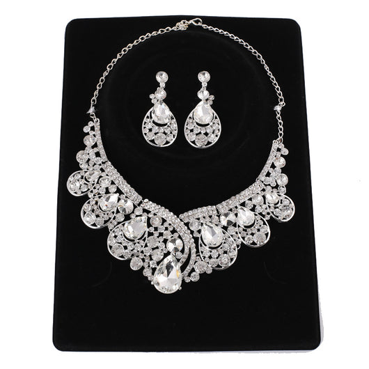 Silver-tone necklace and matching drop earrings set with clear rhinestones and teardrop crystals, ideal for weddings. - Image 4
