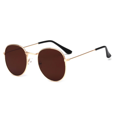 Round metallic sunglasses with iridescent green and gold lenses and a gold-colored metal frame. - Image 23