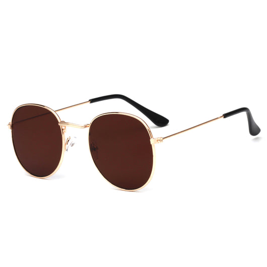 Round metallic sunglasses with iridescent green and gold lenses and a gold-colored metal frame. - Image 23