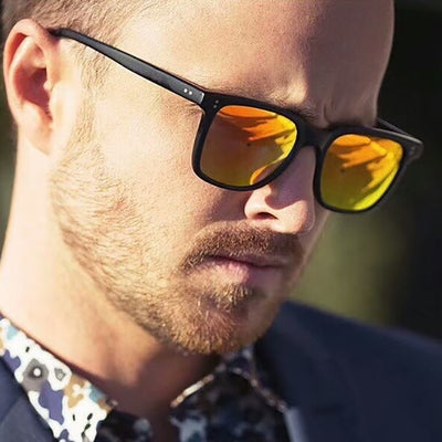 Classic retro midin sunglasses with a black and white striped frame and dark square lenses.