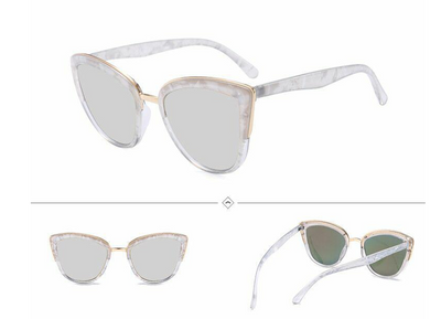 Female cat-eye sunglasses with clear marbled plastic frames, pink mirrored lenses, and gold-tone accents. - Image 7
