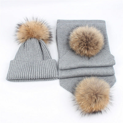 Red knitted hat and scarf set with fluffy brown and black fur pom-poms, ideal for warm winter wear. - Image 14