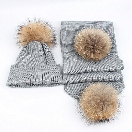 Red knitted hat and scarf set with fluffy brown and black fur pom-poms, ideal for warm winter wear. - Image 14