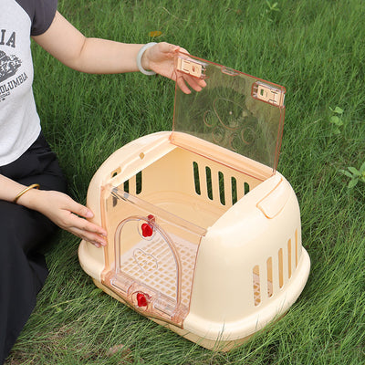 Brown pet carrier with a clear front door, top handle, ventilation slots, and a white urinating pad. - Image 4
