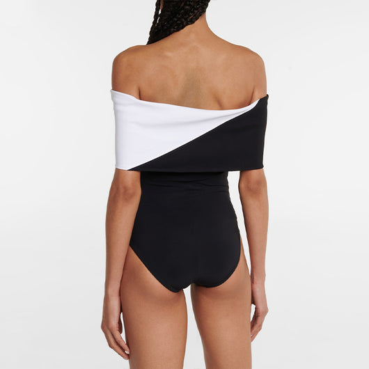 Black one-piece swimsuit with a deep V-neckline and white horizontal stitching detail across the plunge. - Image 20