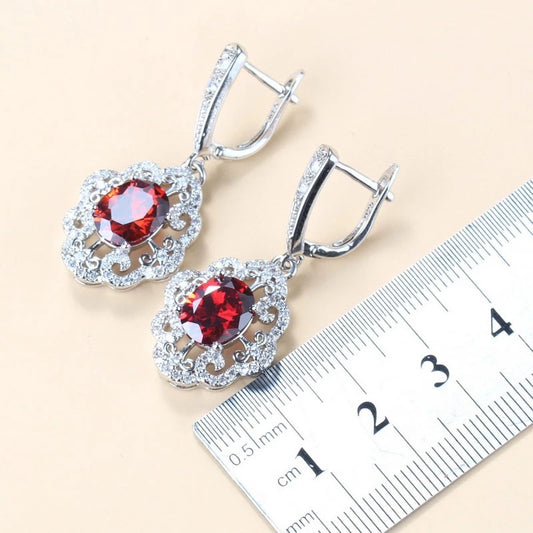 Four-piece jewelry set with silver-tone settings, featuring oval purple cubic zirconia stones surrounded by clear accents. - Image 2