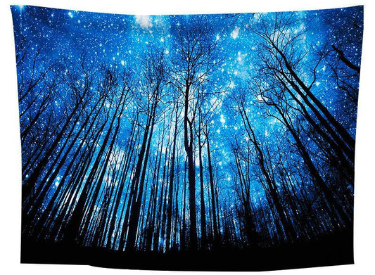 Tapestry featuring a vibrant blue starry night sky seen through a dense forest of tall, dark, bare trees. - Image 2