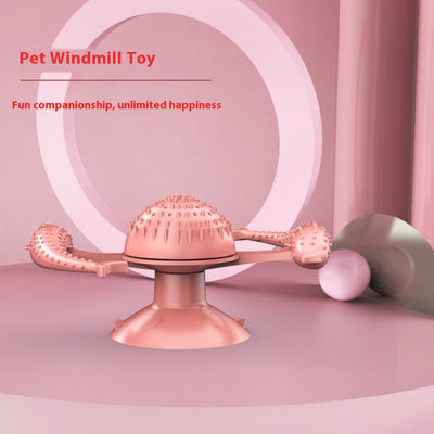 Blue pet toy for cats featuring a spinning windmill design with two dolphin-shaped arms and a suction cup base. - Image 7