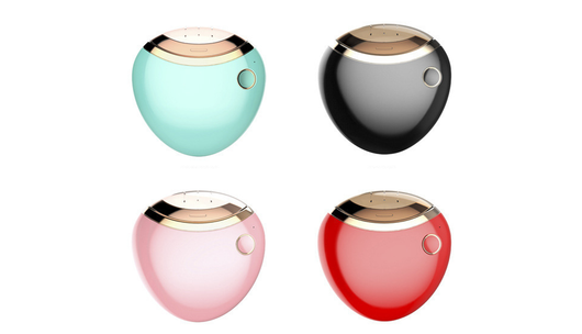 White egg-shaped electric nail clippers trimmer with a gold-toned accent and a single control button.