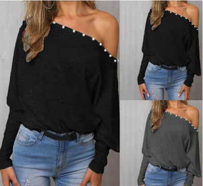 Blusa Elegante con Mangas Murciélago y Detalles de Cuentas