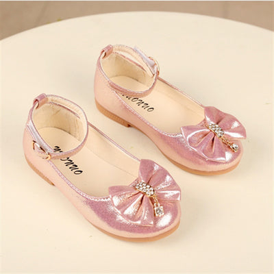 Shiny pink children's ballet flats with ankle straps, decorative bows, and rhinestone embellishments. - Image 4