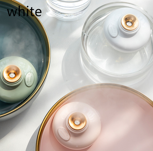 Three 'Drift bottle' humidifiers in white, mint green, and pink, floating in water and emitting mist. - Image 13