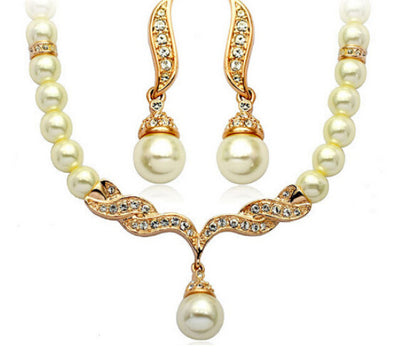 Elegant pearl necklace and matching drop earrings set with sparkling crystal accents, ideal for bridal wear. - Image 4