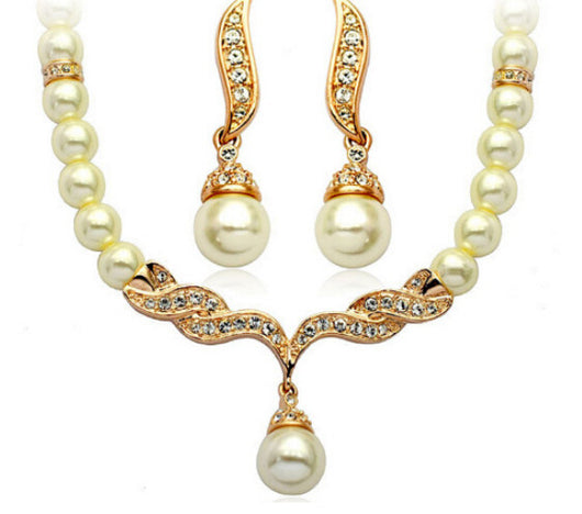 Elegant pearl necklace and matching drop earrings set with sparkling crystal accents, ideal for bridal wear. - Image 4