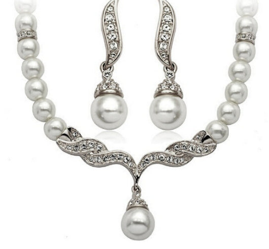 Elegant pearl necklace and matching drop earrings set with sparkling crystal accents, ideal for bridal wear. - Image 5