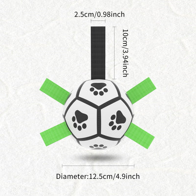 Interactive dog football toy with black and white panels, paw prints, green nylon tabs, and a green carabiner clip. Includes a black inflation pump. - Image 91