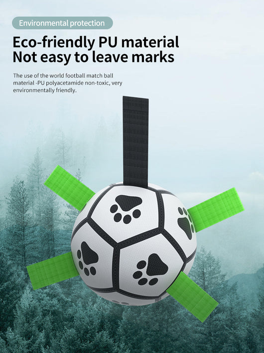 Interactive dog football toy with black and white panels, paw prints, green nylon tabs, and a green carabiner clip. Includes a black inflation pump. - Image 98