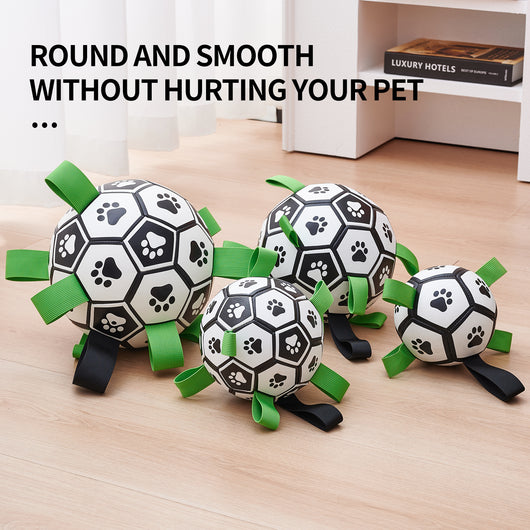 Interactive dog football toy with black and white panels, paw prints, green nylon tabs, and a green carabiner clip. Includes a black inflation pump. - Image 25