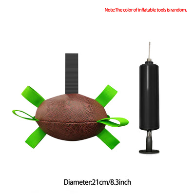Interactive dog football toy with black and white panels, paw prints, green nylon tabs, and a green carabiner clip. Includes a black inflation pump. - Image 38