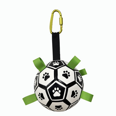 Interactive dog football toy with black and white panels, paw prints, green nylon tabs, and a green carabiner clip. Includes a black inflation pump. - Image 54