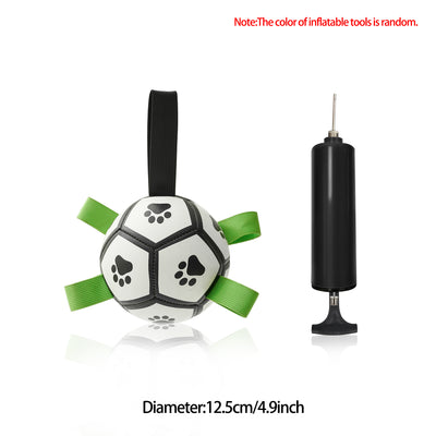 Interactive dog football toy with black and white panels, paw prints, green nylon tabs, and a green carabiner clip. Includes a black inflation pump. - Image 61