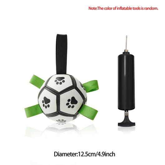 Interactive dog football toy with black and white panels, paw prints, green nylon tabs, and a green carabiner clip. Includes a black inflation pump. - Image 61