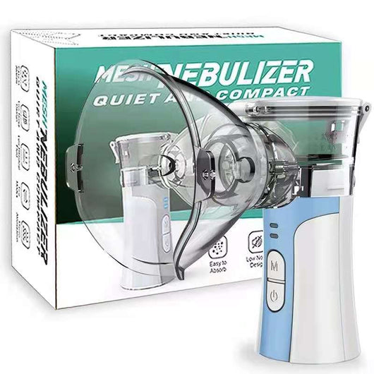 Hand-held compression atomizer with a clear mask and white and blue body, emitting a fine mist. - Image 3