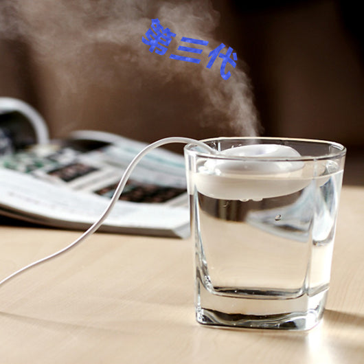 Bright blue donut-shaped mini portable USB air humidifier purifier with a white central filter and silver button. - Image 6