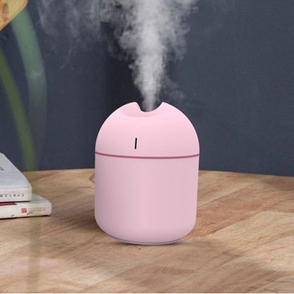 Pink aromatherapy humidifier with a minimalist design and a single mist outlet.