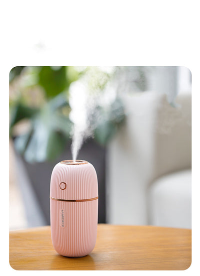 Navy blue portable humidifier with a ribbed texture, silver accents, and a power button on a white background. - Image 5