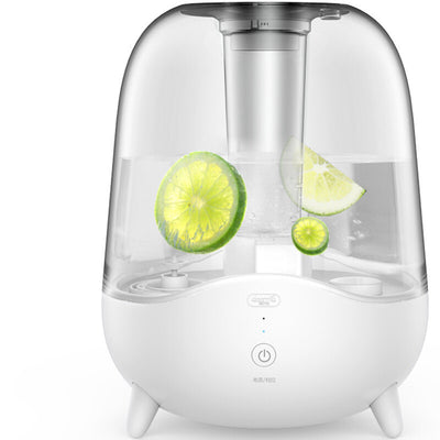 White and clear household silent air humidifier emitting mist, with lemon slices visible in the transparent water tank. - Image 5