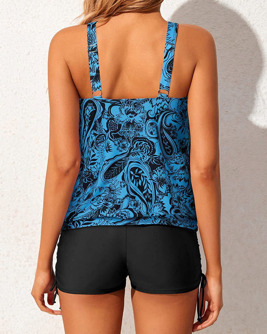 Women's two-piece tankini swimsuit with a colorful abstract print tank top and solid black ruched swim shorts. - Image 25