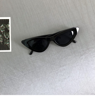 Retro cat-eye sunglasses with a tortoiseshell frame and dark lenses, ideal for a stylish, vintage look. - Image 7