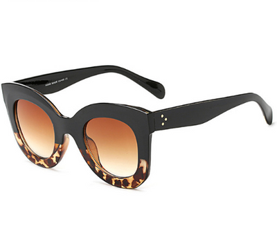 Transparent pink cat-eye sunglasses with gradient gray lenses, featuring a thick frame and vintage style. - Image 5
