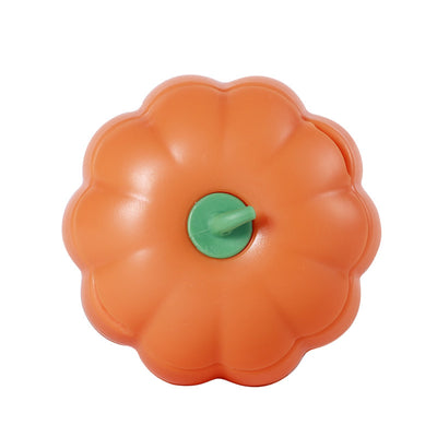 Dark green pumpkin-shaped catnip ball dispenser with a light green stem-like cap for cats. - Image 7