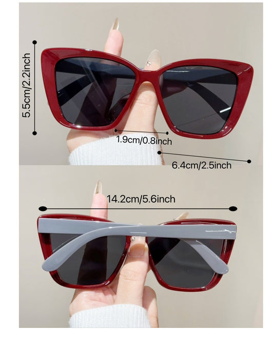 Clear large-frame square glasses held by a hand in a grey knitted sweater, showcasing the transparent plastic frame. - Image 18