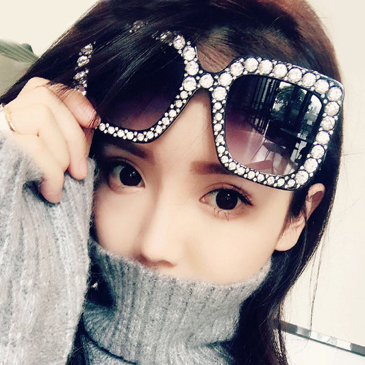 Oversized square sunglasses with clear peach frames, brown lenses, and clear faceted rhinestones around the edges. - Image 2