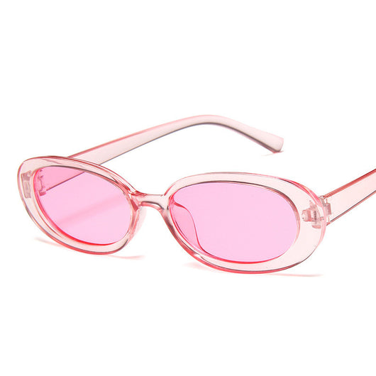 Small frame oval sunglasses with a tortoiseshell pattern and brown lenses on a white background. - Image 6