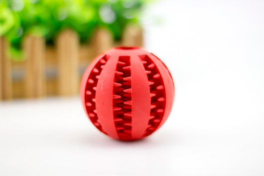 Bright green rubber pet toy ball with textured spikes and ridges for dental cleaning and food dispensing. - Image 12