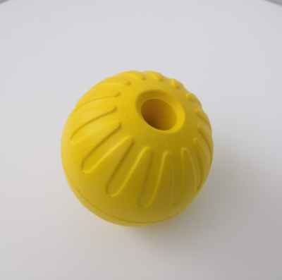 Bright yellow EVA pet ball dog toy with textured grooves and paw print details for interactive play. - Image 6