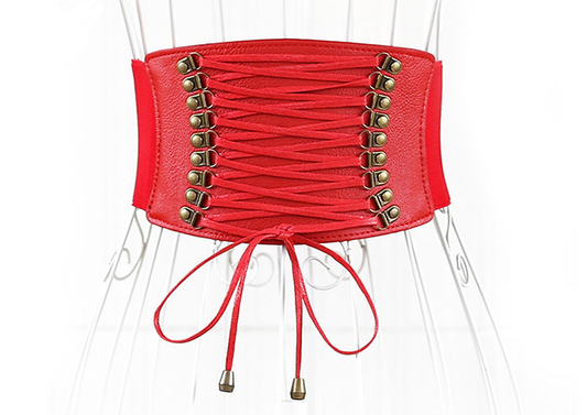 Red wide elastic belt with a faux leather lace-up front panel and bronze-tone eyelets, tied at the bottom.