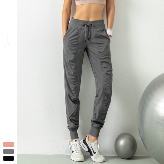 Pantalones deportivos ajustables para running y fitness - Image 13