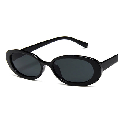 Small frame oval sunglasses with a tortoiseshell pattern and brown lenses on a white background. - Image 5