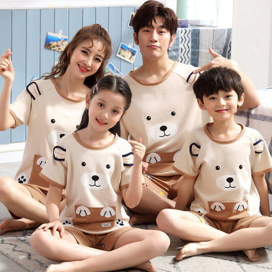 Family of four in matching light blue cotton short-sleeved pajamas with cartoon animal pocket design and 'SLEEP' text. - Image 3