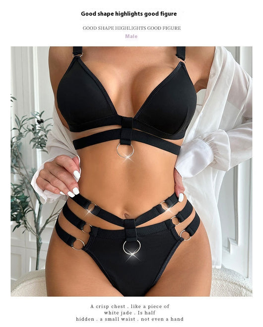 Woman wearing a royal blue strappy lingerie set with O-rings, including a bra, high-waisted bottoms, and a choker. - Image 12