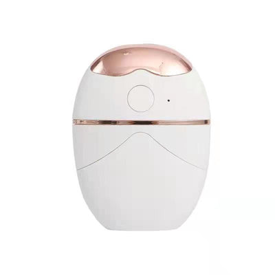 White and rose gold eye protector mini spray and conditioner atomizing device with a smooth, ergonomic design. - Image 12